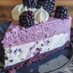 White Chocolate Blackberry Mousse Cheesecake topped with fresh blackberries and whipped cream