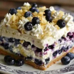 Slice of white chocolate blueberry lasagna with fresh blueberry garnish