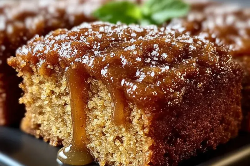 Homemade Amish Applesauce Cake served on a rustic wooden table