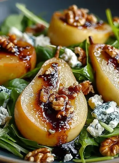 Caramelized pear and blue cheese salad with fresh greens and nuts