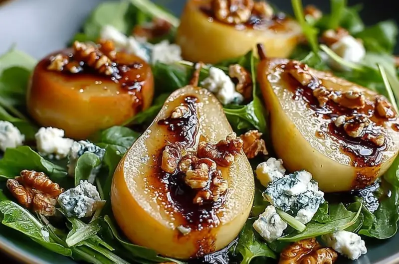 Caramelized pear and blue cheese salad with fresh greens and nuts