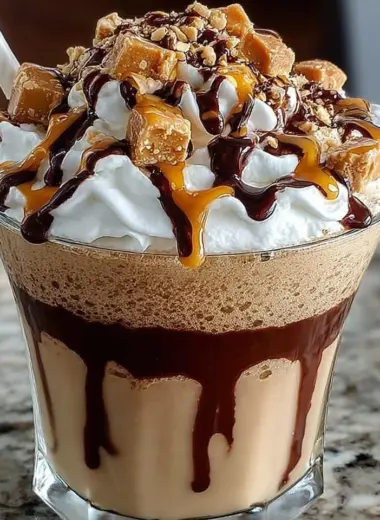 Tasty Reese's Peanut Butter Frappuccino topped with whipped cream.